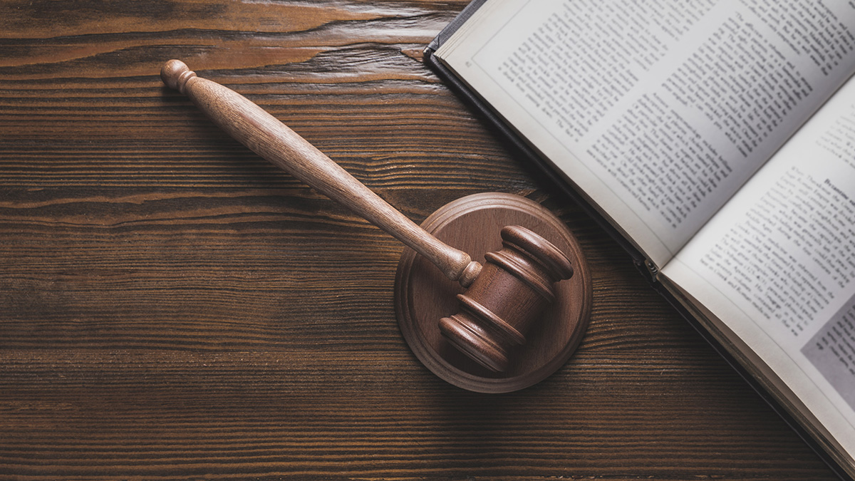 gavel and open law book on table