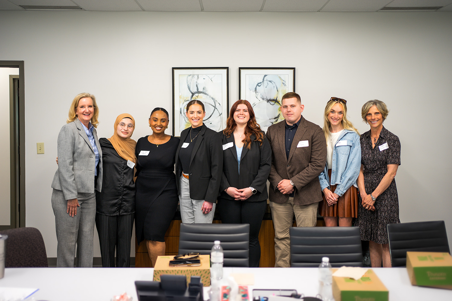 JHC attorneys Dionne Scherff and Lindsey Erickson pose with UMKC Law students during their Lunch at a Law Firm visit in April 2024.