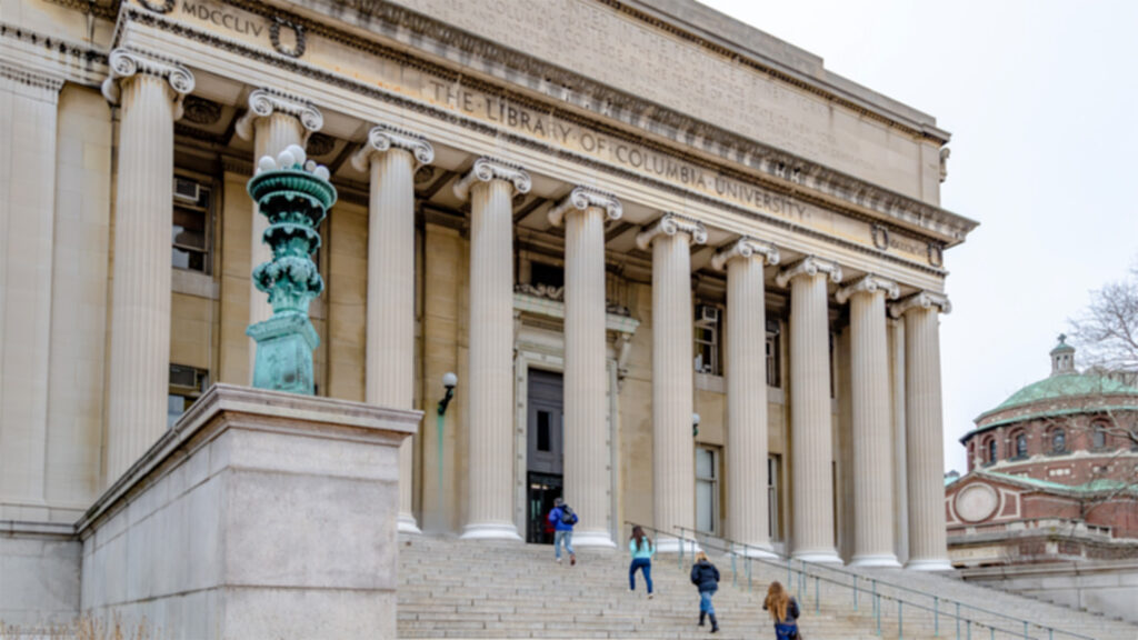 College students ascending the steps of Columbia University Library in New York, NY.